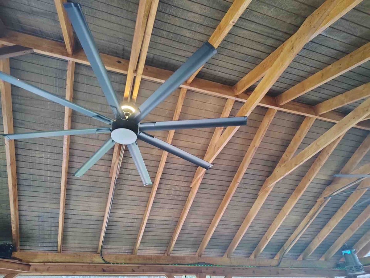 Large ceiling fan with wooden beams